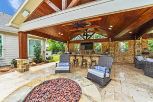 Beautiful custom covered patio complete with an outdoor kitchen.  Built by Backyard Retreats